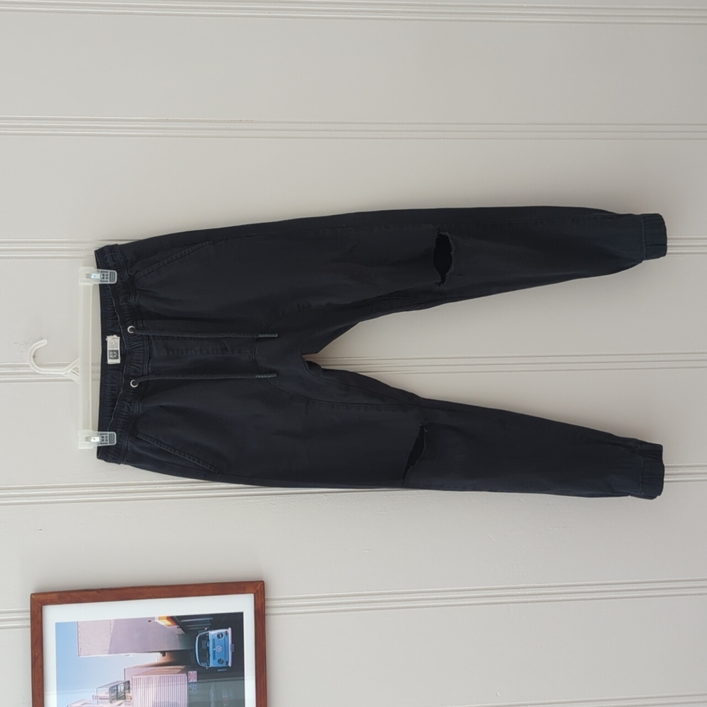 Lira black joggers with ripped knees in small